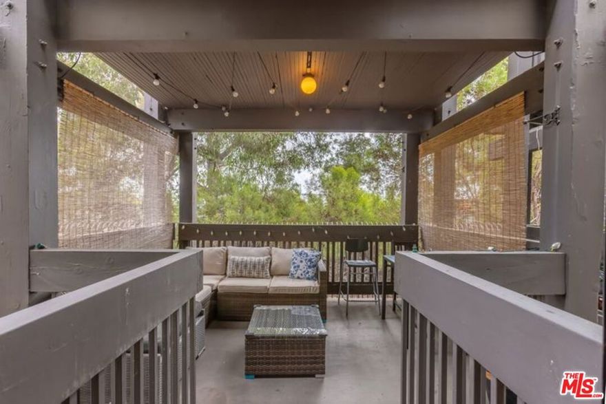 Enjoy a contemporary lifestyle  in a vibrant beach community. This stylish 2-bedroom, 2-bathroom condo spans 1,050 square feet, showcasing new flooring throughout and a bright, south-facing layout. The gourmet kitchen is a focal point, featuring granite countertops and stainless steel appliances. The open living room /dining area leads out to an expansive patio with serene tree top views, perfect for relaxation or entertaining. The primary bedroom suite is a peaceful sanctuary offering a spa inspired bathroom for relaxation. The resort-style complex offers many  amenities including two sparkling pools, soothing spas, saunas, and a state-of-the-art gym. Sports enthusiasts will appreciate the tennis courts, basketball court, and game room. Close to restaurants, shops, beach and bike path.  Embrace coastal living in this welcoming community.