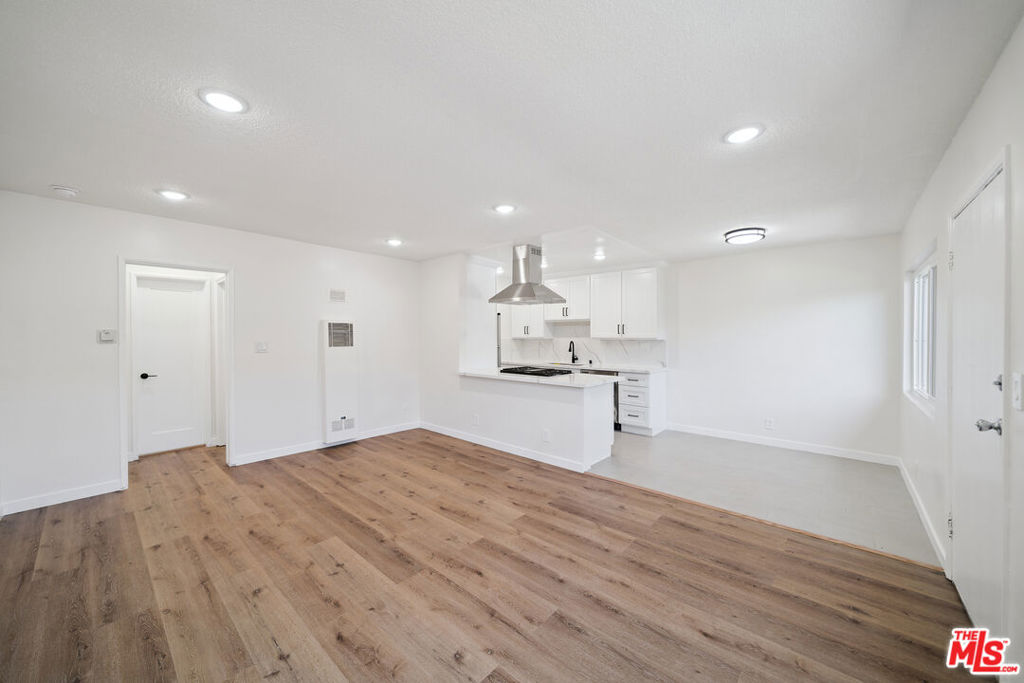 Experience modern West Hollywood living in this newly updated 1-bedroom, 1-bathroom home, available immediately. Flooded with natural light through brand-new double-pane windows, this unit showcases gorgeous new laminate hardwood flooring and a refined, contemporary feel. The kitchen has been completely reimagined with quartz countertops, stylish backsplash, recessed lighting, and new stainless steel appliances. The bathroom continues the fresh aesthetic with updated cabinetry, new paint, and a beautifully refreshed shower. Additional features include on-site laundry, gated parking, and secure building access. A polished home in a sought-after neighborhood, move-in ready and waiting for its next chapter.