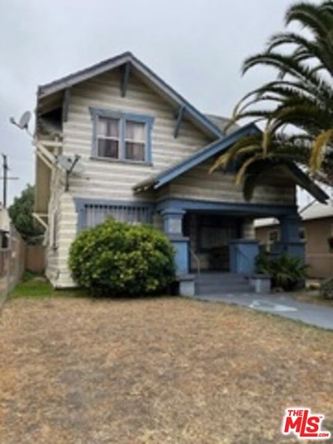 Photo of 1555 W Vernon Avenue, Los Angeles, CA 90062 (MLS # 25622017)