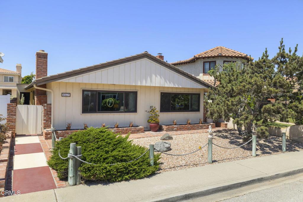 Location, location, location! Welcome to this charming single-story beach bungalow in Mandalay Shores, only one block from the sand. Brimming with vintage character and endless potential, this three-bedroom, two-bath single family home has been lovingly cared for by the same family for more than 40 years. Situated on desirable Island View Street with sidewalks, a front yard, and a cozy back patio, the home also offers a spacious garage with storage and additional parking accessible from Corbina Way--plus plenty of street parking on Island View. Filled with natural light and coastal charm, this sweet home is perfect as a weekend getaway or a full-time beach property. The spacious living area features an oversized rock fireplace, while the kitchen counters and cabinets, bathrooms and nearly all windows have been updated. Additional highlights include a newer furnace, air conditioning, an induction range and tile flooring in the entry and bedrooms. Enjoy daily yoga at Oxnard Beach Park, the Sunday farmers' market at the Channel Islands Harbor, and breathtaking sunsets along the coast. Life at the beach is calling!