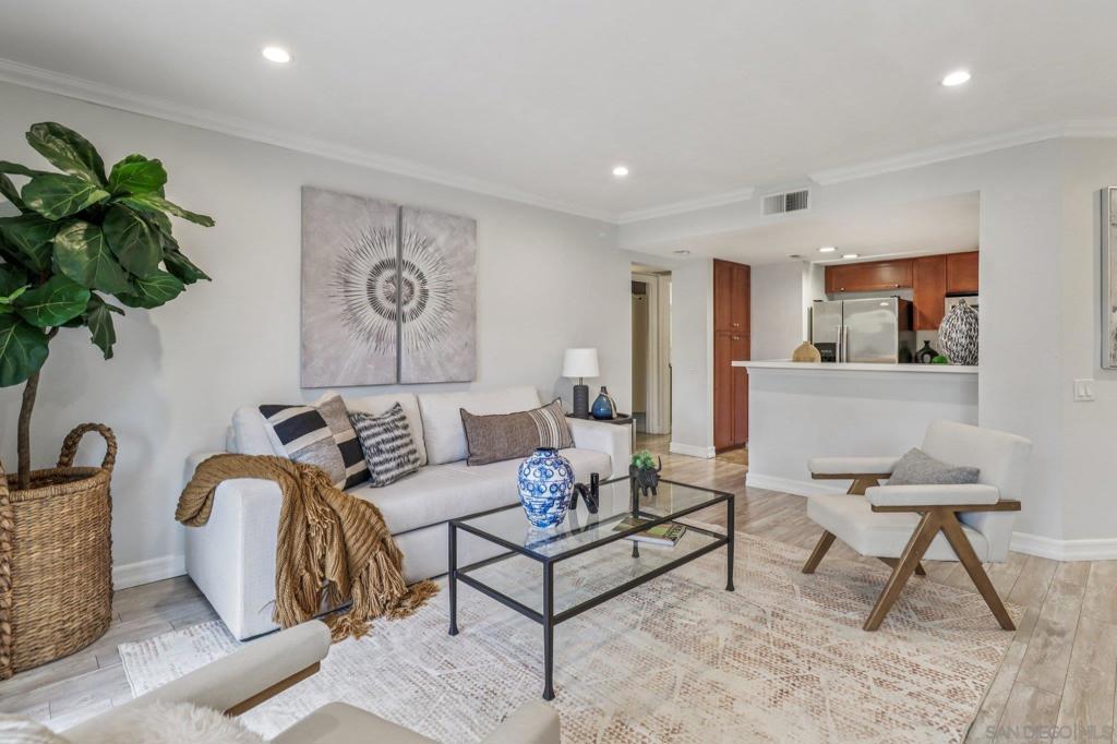 Beautifully updated and move-in ready, this lower-level 1-bedroom condo in the desirable Villa Taviana community offers style and convenience. The bright, open floor plan features a spacious living room with crown molding and an adjoining patio for seamless indoor-outdoor living. The kitchen, complete with breakfast bar, stone counters, stainless appliances, and ample cabinetry, flows into the dining and living areas—perfect for entertaining. The king-sized bedroom includes a walk-in closet with custom barn doors, while in-unit laundry and a large storage closet add practicality. Villa Taviana provides resort-style amenities including two pools and spas, a fitness center, tennis courts, clubhouse, playground, BBQ areas, and EV charging stations. Located within the acclaimed Poway Unified School District, with Turtleback Elementary nearby, plus easy access to shopping, recreation, and freeways, this home is the perfect blend of comfort, convenience, and community.