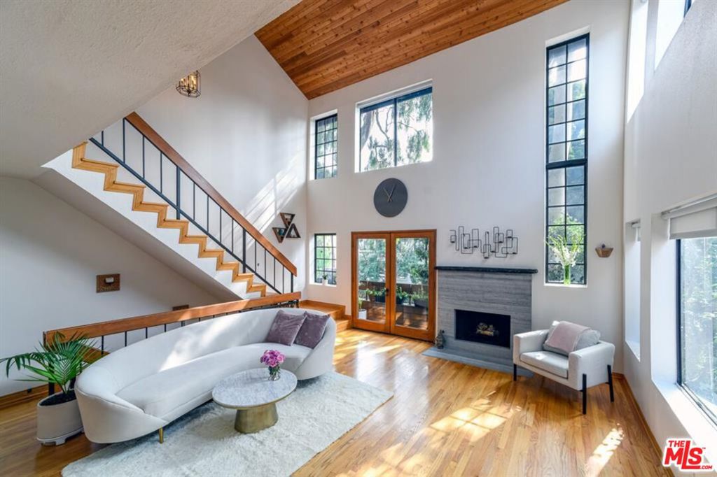 A light-filled, tree-top sanctuary, perfect for professionals craving an easy beach commute, families eyeing westside living, or anyone who wants weekends spent on foot between coffee, markets, and the beach. The three-story townhouse features 1,938 sq ft of space, with 3 bedrooms and 3.5 bathrooms- Soaring 20-ft, south-facing ceilings flood the great room with all-day light through expansive windows and French doors.- Warm hardwood floors run through the main living level and upstairs bedroom, pairing beautifully with an open-concept chef's kitchen, refreshed counters, and stainless steel appliances.- Whole-home smart stack: Philips WiZ app-controlled lighting scenes, Nest thermostat, and an August smart lock put comfort and security at your fingertips.- In-unit washer/dryer tucked into a dedicated laundry room. Lofted primary suite with tree-top views, walk-in closet and a bonus office nook. Two en-suite bedrooms on the lower level, plus side-by-side parking in a gated garage.Located in the sunny southwest corner of Mar Vista where it meets Venice and Culver City West. Walking distance to Bluey's Kitchen, Rockenwagner Bakery, Saba Surf + Coffee, Hatchet Hall, Mar Vista Farmers Market. Easy driving/biking distance to Abbot Kinney, Marina del Rey, and the Venice Pier. Water and trash included