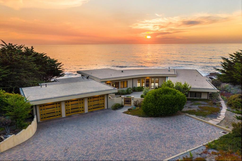 Located 5 miles south of Carmel and within 1.5 hours of the Bay area, this contemporary oceanfront Otter Cove residence is situated on a spacious 1.38 acre lot in the private, gated Otter Cove community. Built in 2004 to the highest standards, this one level 4,233SF home has an open floor plan with 5 bedrooms and 5 1/2 baths and boasts unobstructed 180 panoramic views of the Pacific Ocean all the way to Point Sur. Ocean views are the focal point of every room. The grand living room features a tray ceiling and gas fireplace. The spacious gourmet chef's kitchen is outfitted with a Wolf range, Sub-Zero fridge, and large island. Floor to ceiling windows maximize the incredible views. Outdoor built-in BBQ area and indoor-outdoor living spaces flow together seamlessly to create an extraordinary entertaining experience. From the back patio, steps lead down to a private bench. Additional amenities include a 3-car garage, laundry room, and travertine tile floors with radiant heat.
