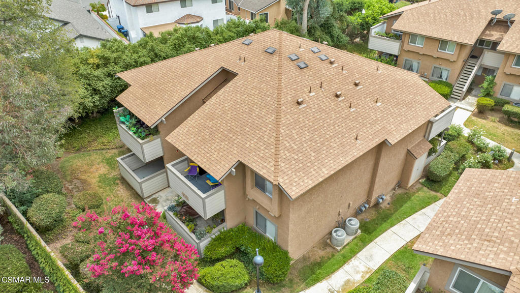 Welcome to 4561 Alamo St #C - a ground-level, open-concept 1 bedroom, 1 full bath condo offering 531 sq. ft. of thoughtfully updated living space in the Alamo Villas community of East Simi Valley. Privately situated at the very back of the complex, this end-unit enjoys a peaceful greenbelt setting with mature shade trees and convenient access to guest parking, walking paths, and community amenities. The inviting patio features an epoxy-coated floor, stucco and wood enclosure, and a covered overhang--an inviting outdoor space to relax or entertain. Inside, the unit was remodeled approximately two years ago and features fresh white paint, crown molding, baseboards, and durable white plank tile flooring throughout. The open-concept layout offers a flexible living, sleeping, and dining arrangement, filled with natural light from a large dual-pane slider that opens to the patio. The kitchen is well-appointed with white cabinetry, white and gray quartz countertops, stainless steel appliances (including a 4-burner gas range/oven, microwave, and refrigerator), a small pantry, and a dining nook with overhead lighting. A walk-in closet with built-in organizers offers generous storage. The full bathroom includes a cultured marble vanity, medicine cabinet, and a tub/shower combination with white tile surround. A dedicated laundry closet adds convenience with a stacked Whirlpool washer and dryer, built-in shelving, and water heater. Community amenities include a pool and spa, mailbox area, and a reserved covered carport space. Per previous listing records, community improvements such as pool resurfacing, exterior painting, and roofing updates were completed around 2022 (buyer to verify). HOA dues include water and trash service. Whether you're a first-time buyer, downsizer, or investor, this clean and move-in ready open-concept 1 bedroom condo offers a smart opportunity in a convenient Simi Valley location--close to parks, hiking trails, shopping, dining, and freeway access.