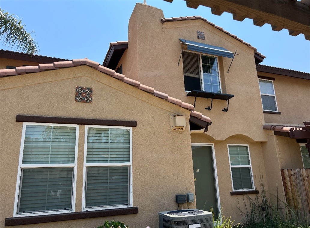 Large Beautiful 3 bedrooms 2 3/4 baths (Formal model townhome with many upgrades). Large tile flooring downstairs. Spacious kitchen has slate counter tops and lots of cabinets. One bedroom and bath downstairs, a cozy fireplace in the living room. 2 bedrooms upstairs. The Spacious upstairs master bedroom has walk in closets with Mirrors, full master bath with dual sinks, private toilet area, The 2nd bedroom upstairs has a bathroom in hallway. Large back yard with a pagoda and retaining block wall. fire sprinklers. 2 car attached garage no shared driveway. Unit has two assigned guest parking in front of unit. Corner lot. Many amenities include tennis courts, basketball courts swimming pool, relaxing spa ,play ground, park, out door BBQ and Security gate.