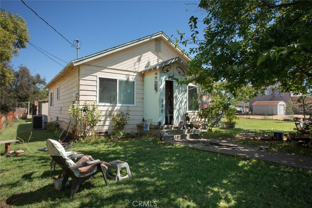 Welcome to this delightful 2-bedroom, 1-bath home on a generous level lot, offering both comfort and space. The property features a usable yard with mature shade trees, perfect for outdoor enjoyment, plus a pull-through gate providing extra parking. Inside, natural light fills the home, highlighting the kitchen with stainless steel appliances and inviting living areas. Convenience is key with the indoor laundry/mud room. Located close to the freeway, downtown, restaurants, and shopping, this home combines a private, serene setting with easy access to amenities. Seize this wonderful opportunity to put your personal touch on a charming home.