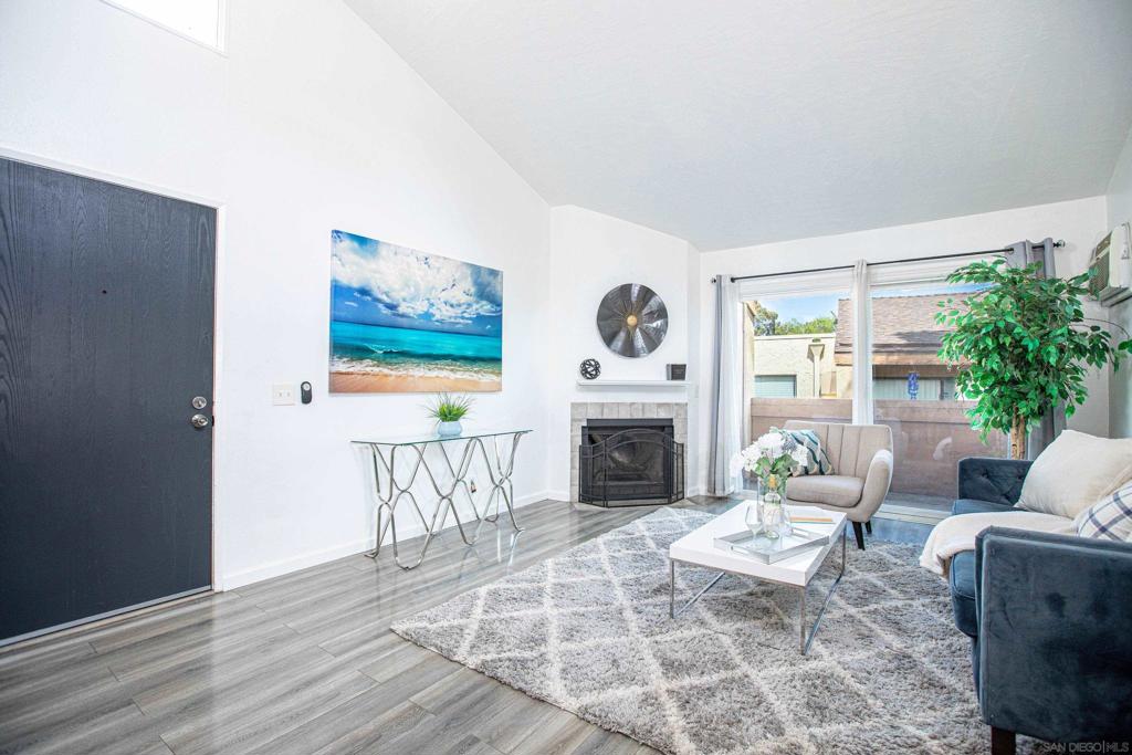 Experience modern comfort in this Bonita condo with soaring ceilings and updated flooring. The open living space features a cozy fireplace, kitchen with quartz counters and stainless steel appliances, plus a private balcony. The bedroom offers a walk-in closet and updated bath. In-unit laundry adds convenience. Parking includes one assigned space and one visitor spot. HOA covers common area, exterior, roof, water, sewer, trash, and pest control. Community amenities include a pool and landscaped grounds