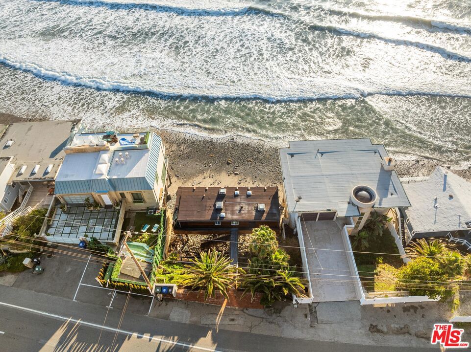 Fresh ocean air and sandy beaches....this absolutely charming oceanfront retreat enjoyed a face lift and ready for new ownership! Just past the county line with 60 feet of private, quiet sandy beach, breathtaking views with French doors in every room that open up to the waves crashing below. This 1 bedroom, 1 bath newly remodeled open floorplan kitchen with new appliances and fixtures is the perfect escape to relax and get away from it all. Take your morning coffee out onto an expansive teakwood deck where you can watch the whales, seals, and dolphins swim right past your house. French Oak floors throughout, a marble shower and large porcelain sink, master bedroom with the most stunning views to wake up to everyday. It is a surfer's paradise with one of the best surfing swells in the country a few feet from your front door. It has excellent income potential! Malibu, Malibu, Malibu!
