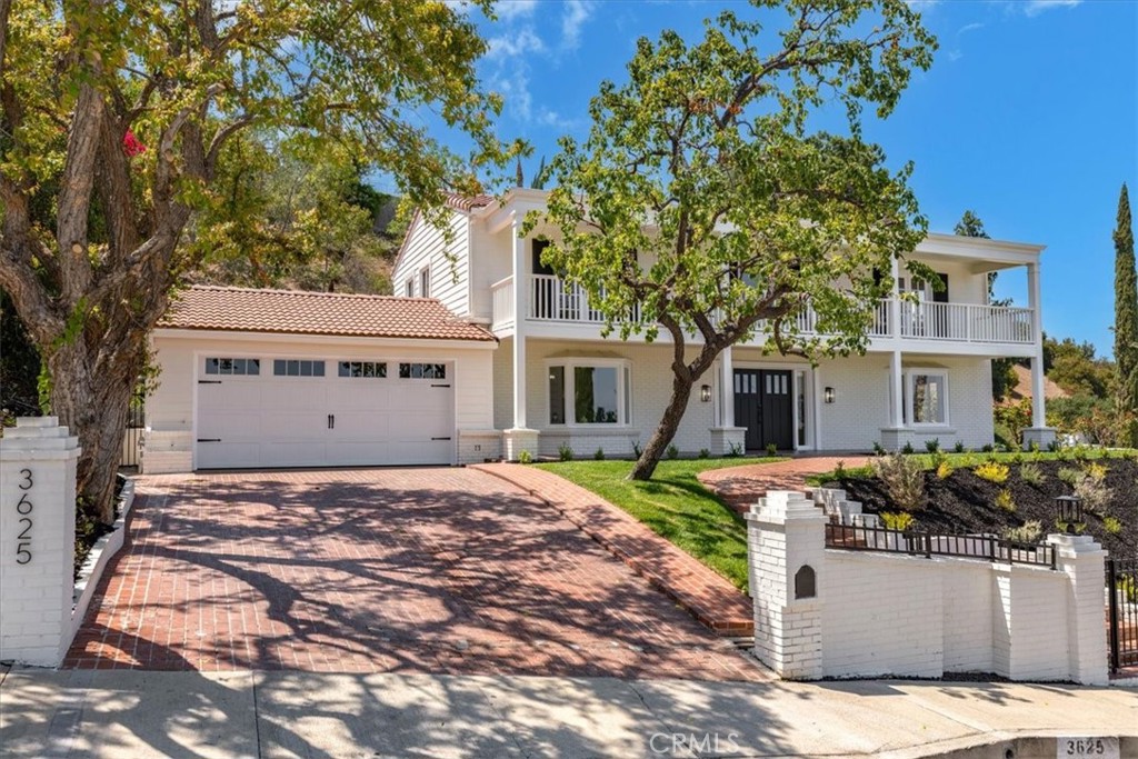 Tucked in the prestigious hills of Encino, this reimagined estate blends timeless traditional elegance with modern luxury. The striking frontage welcomes you through its double doors and into a grand two-story foyer with an elegant entry. The gourmet kitchen is an entertainer’s dream, featuring brand-new stainless-steel appliances, quartz countertops, plenty of new cabinetry and a sunlit breakfast terrace or invite your guests to enjoy a meal in the expansive formal dining room. There is endless space for entertaining with a separate living and family rooms with French doors leading out to the private backyard oasis, an ultimate and private entertainer’s paradise with a sparkling PebbleTec pool, low maintenance turf, and exceptional lounge areas. Downstairs you will find a beautiful private office near the entry, and a spacious laundry/mud room off of the garage and three bathrooms. Upstairs, four bedrooms offer exceptional comfort, which include the lavish primary suite with an updated spa-styled bath, and an oversized walk-in closet. Step outside and have coffee on the front porch and watch the sunrise or unwind and enjoy the views in the afternoon. This spectacular estate offers privacy and luxury in one of Encino’s most coveted neighborhoods.
With easy access to freeways, dining, shopping, hiking trails, and nightlife, embodying the perfect blend of tranquility and convenience in one of LA's most desirable neighborhoods. Just minutes to the Westside, and Mulholland corridor private schools, yet also in the acclaimed Lanai school district - your kids can have it all too! An opportunity you won’t want to miss.