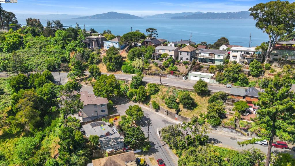 Discover a rare chance to own a prime lot on historic Terrace Ave in the heart of Point Richmond. This sloping terrain invites you to design your ideal retreat—be it a custom residence perched to take advantage of the hillside setting or a lush garden oasis soaking up the Bay Area sunshine. Surrounded by a vibrant, sought-after community, this property’s location is its greatest asset: savor local cafés and restaurants, explore boutique shops, and enjoy cultural events just moments away. Outdoor enthusiasts will love the easy access to waterfront trails and recreational activities, all set against the backdrop of this charming maritime town. Commuters benefit from nearby highways and transit options, ensuring a smooth journey to surrounding Bay Area hubs. Whether you’re an investor seeking an exceptional development opportunity or dreaming of creating your own private haven, this lot’s potential is truly limitless. Don’t miss out on a remarkable piece of Point Richmond’s coastal appeal—schedule a viewing and let your vision take shape on this beautiful blank canvas.