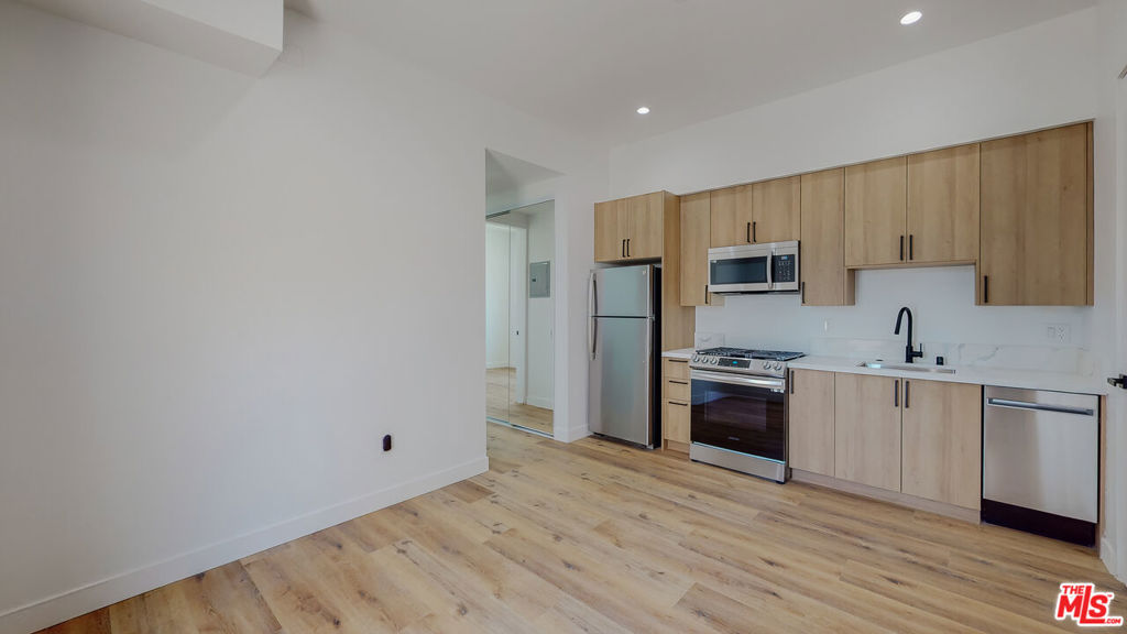 ** PET FRIENDLY ** LARGE PRIVATE BACKYARD ** WASHER/DRYER ** CENTRAL A/C ** MODERN FINISHES ** FLAT UNIT ** Welcome to Maplewood Townhomes, where comfort, charm, and city living come together! This beautiful 2-bedroom, 2-bathroom flat offers a spacious open layout, a huge private yard, and the perfect balance of indoor-outdoor living in one of LA's most desirable central neighborhoods, just south of Melrose Hill. Step inside to find a bright and modern living space with high ceilings, large windows that pour in natural light, and engineered wood flooring that gives the home a warm, inviting feel. The modern kitchen features quartz countertops, stainless steel Samsung appliances, and plenty of cabinet space for storage and style. Both bedrooms are generously sized with ample closet space and modern bathrooms designed with sleek finishes and thoughtful details throughout. Enjoy your own massive private yard perfect for lounging, entertaining, or creating a lush outdoor oasis. It's rare to find this much outdoor space in the city! Additional highlights include in-unit laundry, central heating and cooling, and convenient street parking right out front. Nestled in a prime, walkable area near Melrose Hill, Larchmont Village, and Hollywood, you'll be surrounded by LA's best dining, coffee shops, and nightlife. Just minutes from hotspots like Sqirl, Found Oyster, and Antico Nuovo, as well as everyday conveniences including supermarkets, gyms, and the LA Metro lines. With quick access to the 101 and 10 freeways, getting anywhere in the city is a breeze. Whether you're relaxing at home, entertaining friends, or exploring the vibrant neighborhood, this stunning Maplewood flat offers a true Los Angeles lifestyle, modern, connected, and full of charm.