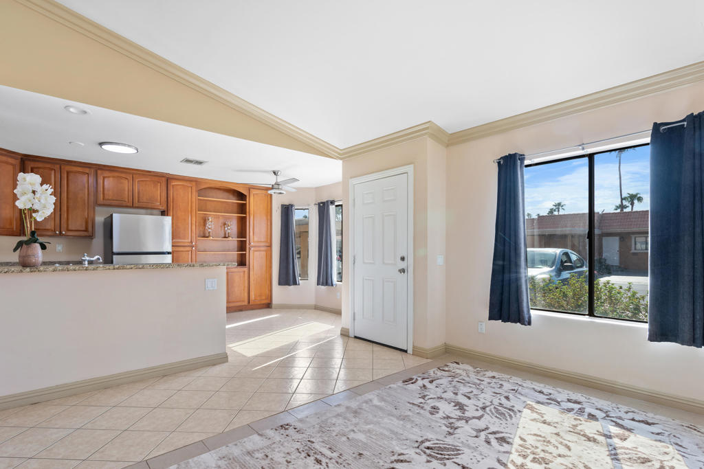 Welcome to this delightful 2-bedroom, 2-bathroom condo located in the desirable Royal Palms Community. This gated enclave offers peace and privacy, all while being just moments from the I-10 freeway on Washington Street for easy access to shopping, dining, and the best of Palm Desert.Inside, the open floor plan is filled with natural light, creating a warm and inviting atmosphere. The kitchen features classic oak cabinetry and granite countertops, with matching granite accents carried into the bathrooms. Tile flooring flows seamlessly throughout the home for both style and convenience. The spacious primary suite includes a walk-in closet and a private en suite bathroom with a walk-in shower, providing the perfect retreat.Homes in Royal Palms are rarely available and highly sought-after--don't miss the chance to make this one yours.