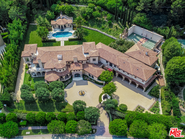 Superbly refined European Villa located behind the ultra-exclusive gates of Beverly Park North. Sited on over 1.8 lush acres, this opulent residence offers approximately 17,000 ft.² of exquisite living space. Artisan quality finishes are highlighted by soaring 30-foot ceilings, hand-painted murals, and Italian stone floors. The palatial master bedroom affords dual spa-inspired baths and two boutique worthy walk-in closets. Six additional en-suite bedrooms complete the main house. The guest residence is nothing short of magnificent with a formal living area, kitchen, & large sleeping quarters. An elevator leads to a spacious game room and 12 seat theater, & world-class gym with dry sauna steam shower and spa area. The heart of the home is a lavish chef's kitchen with Onyx counters, large breakfast room, and jewel-like La Cornue Stove. Private park like grounds are highlighted by rolling lawns, pool, spa, & cabana. A true oasis in one of Beverly Hills most prestigious enclaves.