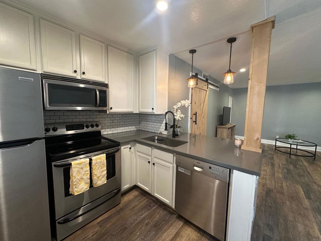 Great Buyer or Investor Opportunity! Don’t miss this updated 1-bedroom, 1-bath end unit—perfect for first-time buyers or savvy investors. This charming home has been freshly painted, features quartz countertops, stylish LVP flooring, and an updated remodeled bathroom with plenty of storage. Enjoy the convenience of in-unit full size washer & dryer hookups and outdoor storage area. Located in a super convenient area with easy access to shopping, transit, and major routes. Move-in ready and full of potential—schedule your tour today!