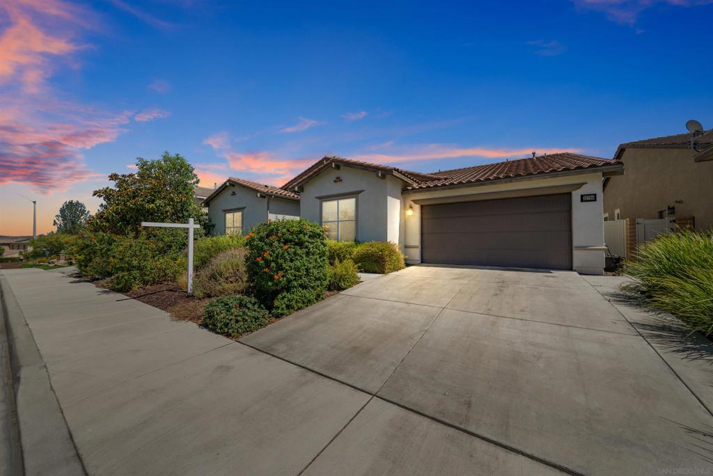 A Stunning single-story home in Liberty at Morningstar Ranch featuring 4 bedrooms, 3.5 bathrooms, and over 3,100 sq ft of open living space. Designed for comfort and flexibility, this home offers soaring ceilings, wood-look flooring, and a gourmet kitchen with granite countertops, stainless steel appliances, a large center island, and a walk-in pantry. Two spacious master suites make it ideal for multigenerational living, and a bonus room provides the perfect space for a home office, playroom, or media room. Accordion-style doors lead to a beautifully landscaped backyard with a California Room, fire pit, and low-maintenance turf—perfect for seamless indoor-outdoor living. Located in the sought-after Liberty at Morningstar Ranch community within the top-rated Temecula school district and close to parks, shopping, and award-winning wineries.