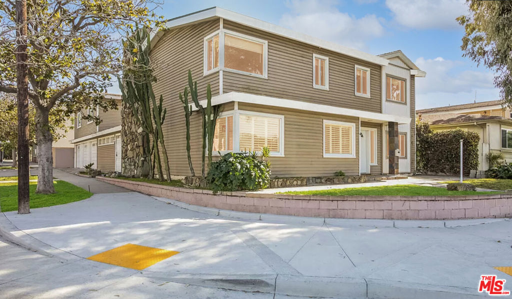 This charming Playa Del Rey single-family home, set on a rare corner lot less than a mile from the beach, perfectly blends quintessential California living with the added bonus of an income-producing ADU. The beautifully updated main house offers 4 bedrooms, 3 bathrooms, and 2,268 sq ft of bright, open living space, featuring a fully renovated kitchen with modern finishes designed for comfort and entertaining. Above the 3-car garage sits a separate updated 2-bedroom, 1-bathroom ADU with private entry, offering 783 sq ft of move-in-ready space ideal for long-term rental or Airbnb income. Zoned R3, this property has the potential to develop up to 7 units with no rent control, presenting multiple value-add options such as converting the garage, developing multi-units, or holding as a high-performing investment. Located steps from the sand, bike paths, LMU, shops, restaurants, and commuter routes, this turnkey property is a rare opportunity in an area with extremely low inventory. Whether you're seeking passive income, long-term development potential, or your dream coastal home, this Playa Del Rey gem delivers on every front. ** Buyer to verify all current square footage, permits and development opportunities.