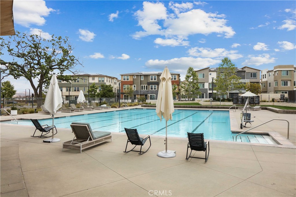 ***This condo is FHA and VA APPROVED, and it qualifies for DOWN PAYMENT Assistance programs OR Zero Down Payment Programs. Welcome to this stunning turnkey 1-bedroom condo, nestled in the highly sought-after Valencia Five Points Community. Designed with both style and comfort in mind, this pristine home is your perfect retreat.
Step inside to be greeted by high ceilings, an abundance of natural light, and a thoughtfully placed balcony that seamlessly extends the living space outdoors. The open-concept kitchen is both spacious and stylish, featuring newer stainless steel appliances and modern finishes—perfect for everyday cooking or entertaining. The inviting living room offers a cozy retreat, while extras like recessed lighting, in-unit laundry, an exterior storage closet, leased solar panels, and a 1-car garage provide convenience and low maintenance living. This condo has been exceptionally maintained and cared for!
You’ll also enjoy resort-style HOA amenities including: 3 unique swimming pools, Outdoor fire pit with ample seating, Community Center and Garden, Picnic areas, scenic walking trails, dog stations and so much more!
Located just minutes from award-winning schools, golf courses, Westfield Mall, Six Flags Magic Mountain, and with easy freeway access. Don’t miss out on this opportunity—schedule your private showing today!