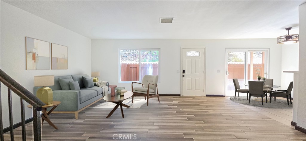 Adorable and Affordable 2 story, 2 bedroom condo in quiet Murrieta neighborhood has been updated and is move-in ready. Private entry, fenced patio off of kitchen with sliding glass door. New plank tile in entry and living room. Owner to leave extra tile for finishing kitchen and dining areas. White cabinetry with new black hardware, quartz countertops with stainless steel farm sink. Newer stainless steel appliances. Washer and Dryer hook-ups off kitchen for convenience. Half-bath on stair case landing for easy access. Extra large storage under stairs. Built in niche in living room can be used for work/craft space. Upstairs are the primary bedroom with private entrance into full bathroom with white cabinetry and quartz countertop, walk-in closet with built-in organizers. Secondary bedroom has nice natural lighting and is spacious. Both bedrooms have ceiling fans/lights. Comes with Nest thermostat. Private lockable storage, shared garage and small community park area. Great opportunity for first time buyers or investors. Close to I-15/I-215, shopping, golfing, medical facilities and wine country close by.