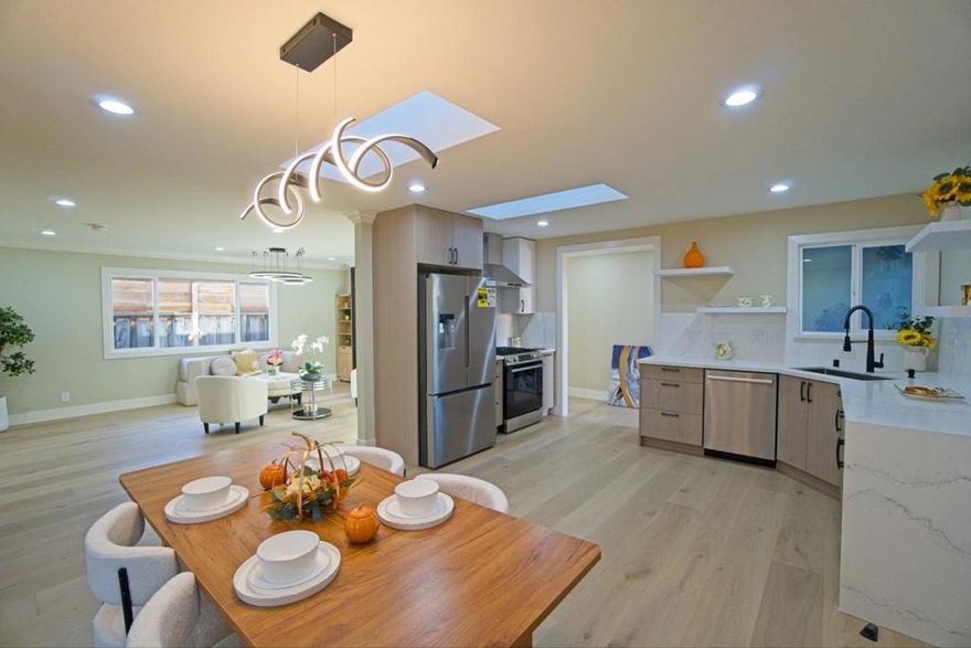 RENOVATED WITH PERMITS, CITY FINAL APPROVED & EAST-FACING. Welcome to this spacious 4-bedroom, 3-bathroom home in the vibrant city of Sunnyvale's Ponderosa Park neighborhood. 2 are primary bedrooms with their en-suites. With a generous 1,582 sq ft of living space, this property offers a comfortable and modern lifestyle. The kitchen is a chef's dream, featuring quartz countertops, a gas oven range, dishwasher, garbage disposal, and a skylight that fills the space with natural light. The family room, dining area & outdoor gazebo provide a perfect setting for family & friends gatherings.  This home includes 2 primary bedrooms with updated bathrooms. The flooring throughout is engineered wood, enhancing the home's warmth and style. Enjoy cozy evenings by the fireplace, and benefit from central AC and heating for year-round comfort.  Improved amenities include a 2-car garage with EV outlet, laundry facilities with gas dryer hookups in the garage, and energy-efficient features such as double-pane windows and Energy Star appliances. Located in the Santa Clara Unified School District, this property is an excellent choice for those seeking a family-friendly environment. It is just 1 block away from Ponderosa Park.