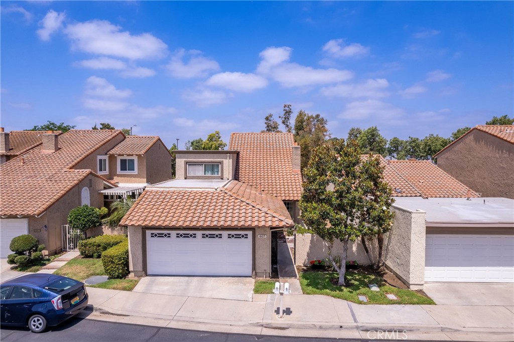 Beautiful Home in the highly desirable Granada Park gated community! Step through the double entry doors into a light-filled interior featuring cathedral ceiling and a cozy file place in the living room. With 4 spacious bedrooms and 3 bathrooms, including a convenient downstairs bedroom and bath, this layout is perfect for guests or multi-generational living. The home boasts multiple living areas, including a formal living room, dining room, family room and well appointed kitchen. Upstairs, the primary suite is with double doors, high ceiling, and plenty of space. The home is equipped with double pane windows for energy efficiency and a quiet, comfortable environment. A newer AC system installed approx. 5 years ago and replumbing done within the last 2 years, ensures year-round comfort and peace of mind. Enjoy beautifully enclosed yards-perfect for outdoor dining, entertaining or simply relaxing. Conveniently located walking distance to schools, near shopping and Fwy access, this home offers the perfect blend of comfort, style, and convenience. HOA covers roofing, exterior painting in every 5 years, basic internet/TV, front yard (detail to be confirmed with HOA). Don't miss out on this great opportunity!