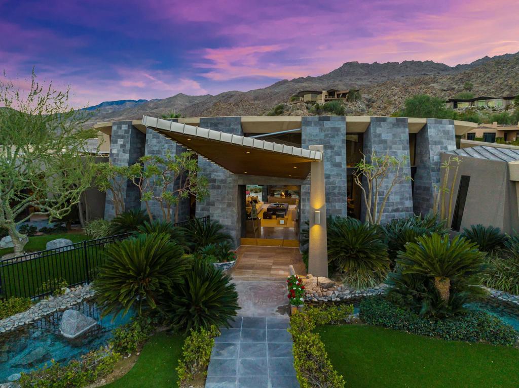 This exquisite contemporary compound designed by award-winning Architect Guy Dreier is elegantly nestled behind the gates of Bighorn Golf Club, the most exclusive private club in the Coachella Valley. Situated on a double homesite, offering a sprawling 1.21 acre lot with streams, waterfalls, a beach pool, spas, and lush landscaping, complemented by the dramatic angular lines that are signature to Guy Dreier architecture. An impressive walkway to your front door leads you inside to timeless, livable luxury. The echoing waters outside are brought indoors with a Zen-like stream connecting inside to outside. The 9950 sq ft of living space offers 7 spacious bedrooms all with en-suite full baths, plus 2 additional indoor 1/2 baths & an outdoor 1/2 bath. The living room & entertaining areas offer Fleetwood sliders that open completely to connect the indoor luxury with the outdoor entertainment. The sizable primary suite is complete with living room/sitting area, opulent fireplace, spa-like bathroom with marble steam shower and luxurious bench. Outdoor bedroom area with full pool/spa recently added complete with outdoor shower. Located on the 2nd fairway of the Bighorn Mountains Course offering golf course views, dominating Santa Rosa & San Jacinto Mountain views & Valley views. Amenities include three casitas for your family, friends or guests. Owned solar, gym, media room, two home offices, and multiple entertaining areas. Welcome home - enjoy the Bighorn lifestyle!