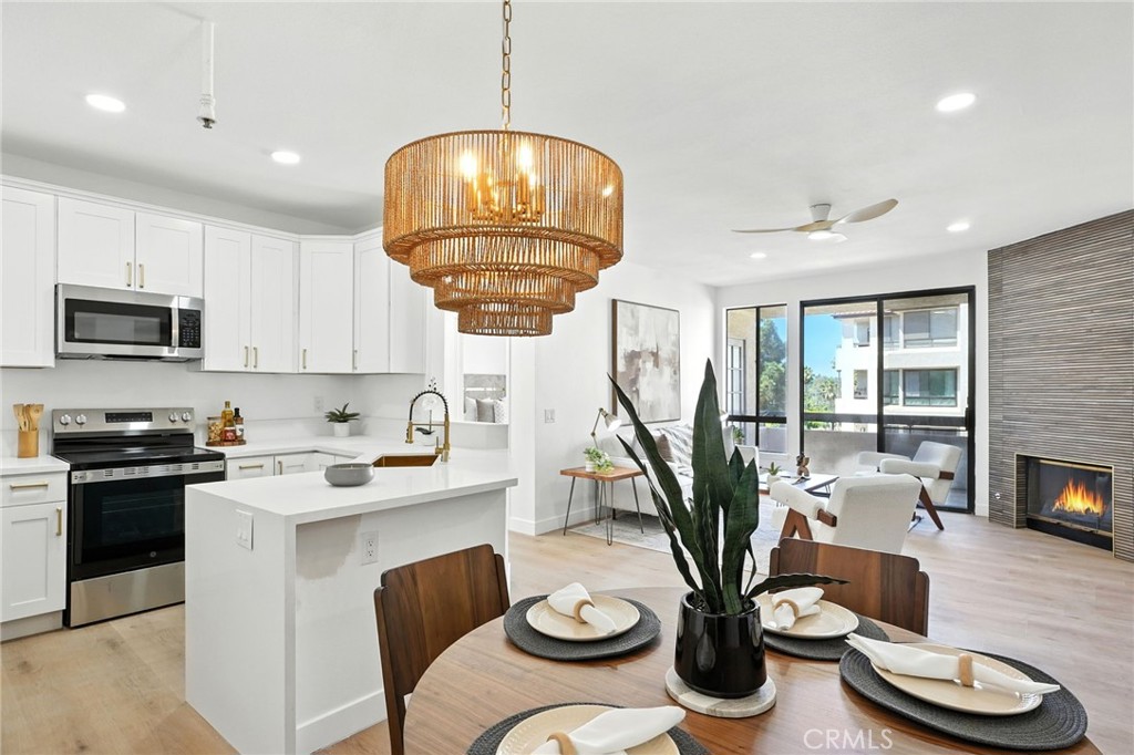 5875 Friars Rd #4314 in San Diego is a newly remodeled two-bedroom, two-bath condominium located in the highly desirable Courtyards community in Mission Valley. Positioned on the fourth floor, this residence offers a perfect balance of privacy and convenience with resort-style amenities at your doorstep. The interior has been thoughtfully updated with new luxury flooring, fresh paint, plush carpet, and modern finishes throughout. High ceilings, recessed lighting, and expansive windows fill the home with natural light while showcasing serene panoramic views. The kitchen is appointed with quartz countertops, updated cabinetry, and stainless steel appliances, while the living room centers around a marble-surround fireplace. The spacious primary suite includes a walk-in closet, a second closet, and a spa-inspired bathroom with a soaking tub. A large covered balcony overlooks tranquil ponds and fountains, creating a relaxing retreat. Additional highlights include renovated bathrooms with designer upgrades and in-unit laundry for everyday convenience. The Courtyards community provides an unmatched lifestyle with multiple pools, spa, sauna, fitness center, tennis courts, a large dog park, and meticulously landscaped grounds with calming water features. Residents also benefit from two designated garage parking spaces, 24-hour security, a gated entry with a guard, and on-site maintenance services. Ideally situated near USD, Fashion Valley Mall, Old Town, Downtown San Diego, beaches, and major freeways, this home offers exceptional access to shopping, dining, recreation, and entertainment. Move-in ready and meticulously maintained, this property combines contemporary design, resort-style living, and an unbeatable Mission Valley location.