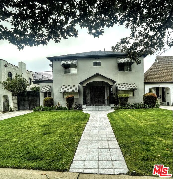 Welcome to 1329 S Genesee Ave, a stunning single-family residence with classic charm with modern day conveniences. This spacious home offers 3,042 square feet of living space.As you step inside, you are greeted by an charming entry that connects the living areas, creating an ideal setting for both everyday living and hosting gatherings. The cozy kitchen is equipped with modern appliances and counter space, making meal preparation a breeze. Adjacent to the kitchen, the dining area offers a perfect spot for enjoying meals and creating unforgettable memories.The primary suite features a spacious layout and an en-suite bathroom. The additional bedrooms are equally impressive, offering comfort and flexibility for guests or office space.Located in the Mid-Wilshire section of Los Angeles, this home offers convenient access to a variety of dining, shopping, and entertainment options. Don't miss the opportunity to make this exquisite residence your own.