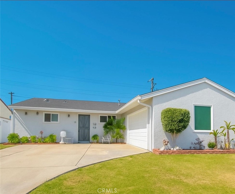 Welcome to this delightful 3-bedroom, 1.5-bath Home, ideally situated in the vibrant heart of Cypress. Boasting a spacious open floor plan, this 1,330 sq ft home sits on a generous 6,000 sq ft lot, offering both comfort and functionality. Recent updates include paint and Vinyl flooring, as well as energy-efficient double-paned windows installed just a year in a half ago. The expansive driveway easily accommodates up to 5 vehicles or an RV, complemented by a full-sized 2-car garage—perfect for families and entertainers alike. This home is move-in ready, with a layout that invites you to make it your own. Enjoy unparalleled convenience with top-rated schools just a short stroll away, including Oxford Academy, Cypress High School, Lexington Junior High, and Cypress College. You're also moments from premier shopping, dining, and local parks, making this location as practical as it is desirable. It won't last!