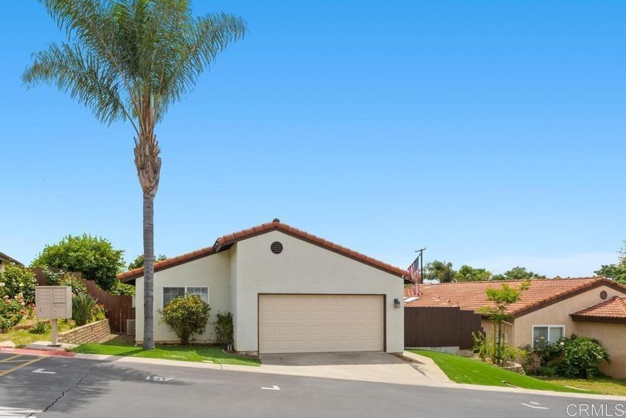 Welcome to 157 Belfast in Escondido, CA, where modern living meets comfort in this charming 3-bedroom, 2-bathroom home. Spanning 1,154 square feet, this residence offers a seamless blend of functionality and style, perfectly situated on a 4,791 square foot lot. Step inside to discover a spacious interior featuring vaulted ceilings that create an airy and open atmosphere. The family room invites you to unwind by the wood-burning fireplace, while the combination of carpet and tile flooring adds a touch of elegance to every step. The well-appointed kitchen comes equipped with essential appliances, making meal preparation a delight. Enjoy the comfort of air conditioning on warm days produced by the owned solar panels, ensuring a pleasant environment year-round  Outside, the low-maintenance artificial turf in both the front and backyard offers a lush, green space without the hassle of upkeep. The covered patio is perfect for outdoor gatherings or a quiet retreat, providing a private outdoor oasis.