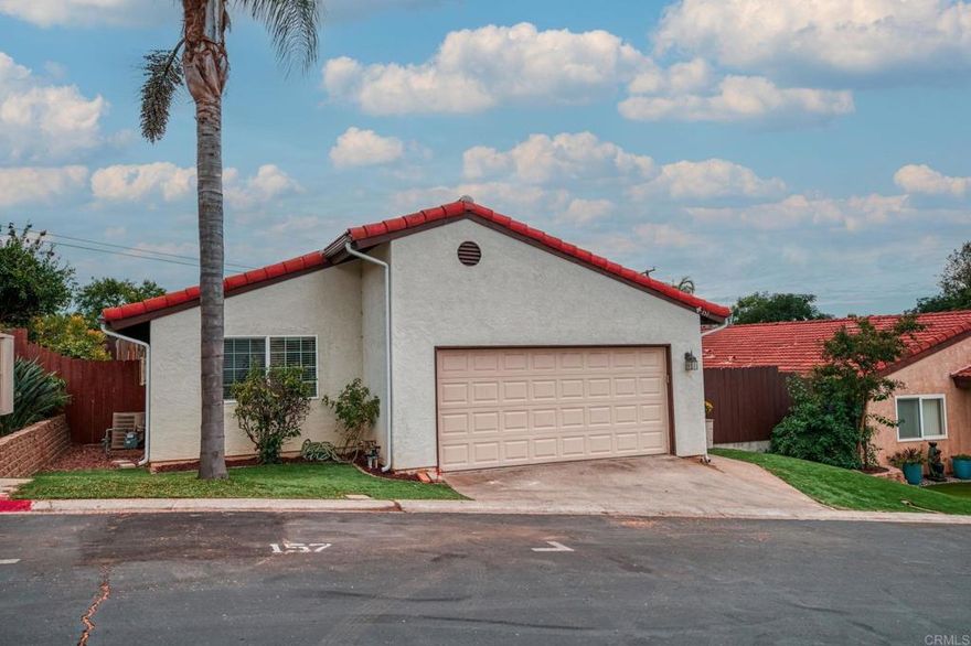 Welcome to 157 Belfast in Escondido, CA, where modern living meets comfort in this charming 3-bedroom, 2-bathroom home. Spanning 1,154 square feet, this residence offers a seamless blend of functionality and style, perfectly situated on a 4,791 square foot lot. Step inside to discover a spacious interior featuring vaulted ceilings that create an airy and open atmosphere. The family room invites you to unwind by the wood-burning fireplace, while the combination of carpet and tile flooring adds a touch of elegance to every step. The well-appointed kitchen comes equipped with essential appliances, making meal preparation a delight. Enjoy the comfort of air conditioning on warm days produced by the owned solar panels, ensuring a pleasant environment year-round  Outside, the low-maintenance artificial turf in both the front and backyard offers a lush, green space without the hassle of upkeep. The covered patio is perfect for outdoor gatherings or a quiet retreat, providing a private outdoor oasis.