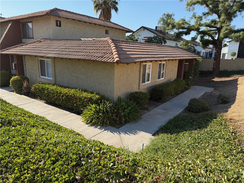 Beautiful Ground-Floor, Single-Story Condo in Gated Community. This desirable single-story condominium has no neighbors above or below. The property is located within the secure, gated community of Lido in Grand Terrace. This inviting home offers a spacious living room, a sunny breakfast nook off the kitchen, three bedrooms, and two full baths. The updated kitchen features granite countertops, tile floors, and modern appliances, while interior laundry hookups add everyday convenience. Recent renovations include new carpet flooring throughout and fresh paint. Enjoy the large private concrete patio and fenced yard—perfect for relaxing or entertaining. Community amenities include a sparkling pool and spa, tennis court, guest parking inside the gates, and additional parking outside. Ideally located near schools, shopping, and just minutes from Loma Linda University Medical Center and the VA Hospital.