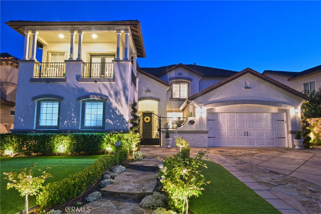 Unparalled Luxury in Serrano Heights! Experience uncompromised quality with sophisticated living in this meticulously upgraded 5 bed, 3 bath, 3,305 square foot designer home with breathtaking Catalina & city light views. Nestled on a single-loaded cul-de-sac this residence on a 6,523 sq ft lot features a split 3-car garage. Step into opulence: Restoration Hardware chandelier, luxury vinyl flooring, crown molding, and LED lighting enhance the grand entryway. The chef's kitchen is a culinary haven with Monogram appliances (column fridge/freezer, 6-burner range, Advantium oven), Best downdraft, Thermador beverage cooler, Shaws sink with Waterstone faucet, quartz waterfall island, marble backsplash, and custom brass/glass shelving. A custom dining counter features brass pendants. Luxurious retreats await: The master suite boasts stunning views, full wall moldings, and a spa-like bath with Kohler & Brizo fixtures, marble accents, a freestanding tub, and a lighted vanity. Upper bedrooms offer unique details like wainscoting and built-ins. A lower bedroom suite provides convenience. All bathrooms are gorgeous and feature upgraded fixtures beautiful shower enclosures and quartz counters. The laundry room has a quartz shelf and dog shower. Outdoor living is exceptional: Updated stone veneer, artificial turf, solar panels with battery back up, EV plug, gated courtyard with fountain, and a backyard perfect for entertaining with a pebbletec salt pool/jacuzzi with waterfall and baja step, covered patio with fan, and an 8-seater outdoor kitchen island. Other detailed property features include automated lighting, custom drapery, two fireplaces, upgraded garage with epoxy floors & built-ins, water softener, Emtek brass hardware, new Kohler toilets, and remote-controlled ceiling fans, quartz window sills and decorative window/wall moldings. Fabulous community with Low HOA dues and panoramic views to the ocean, Catalina and city lights.This home is superb in quality and offers a lifestyle of refined luxury.