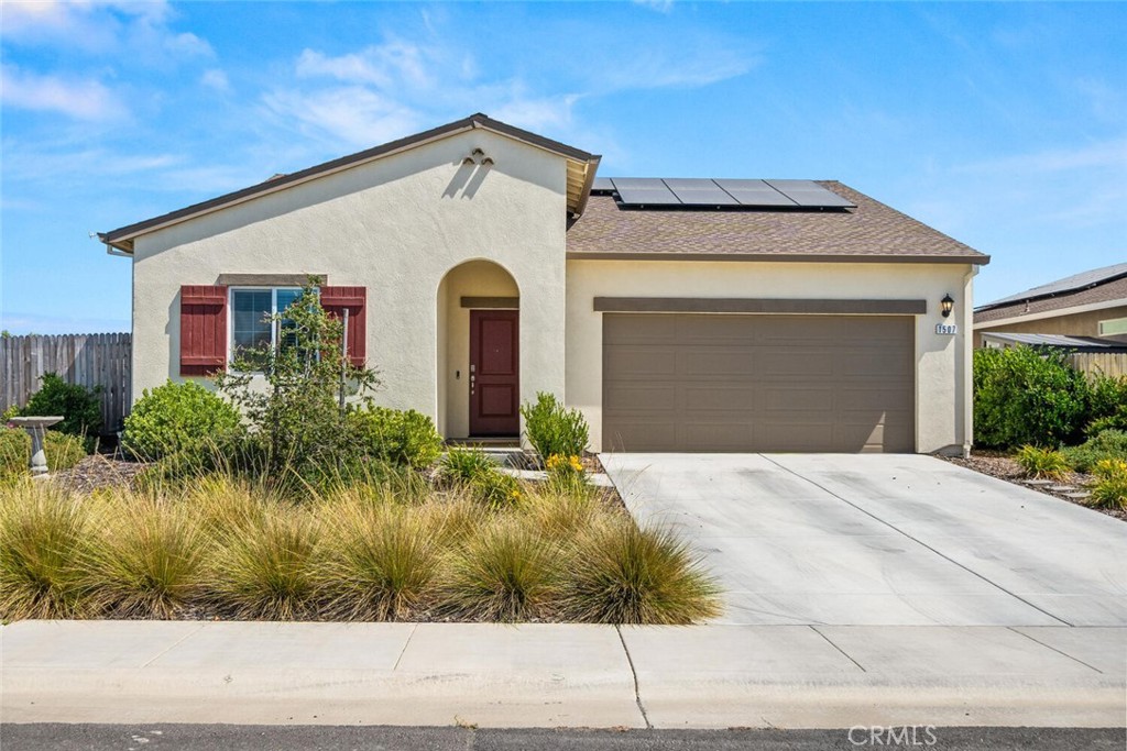 Built just 2 years ago and nestled in a newer neighborhood, this turnkey 3-bedroom, 2-bath home sits on a generous corner lot and blends modern comfort with functional design. From the moment you step inside, you'll appreciate the 9-foot ceilings and durable luxury vinyl plank flooring that runs throughout the home. The open-concept floor plan features a spacious living room that flows effortlessly into the dining area and stylish kitchen—perfect for entertaining or everyday living. The kitchen boasts soft-close white shaker cabinets, sleek quartz countertops, a large center island, stainless steel appliances, and a gas range, ideal for any home chef. The primary suite offers a peaceful retreat, complete with a walk-in closet and en-suite bathroom featuring dual vanities with quartz counters and a huge walk-in shower. Two additional guest bedrooms are generously sized and share a full bathroom with a quartz vanity and a tub/shower combo. Step outside to a large backyard brimming with potential! Enjoy the raised garden beds, cozy fire pit, and established fruit trees. Additional highlights include a separate indoor laundry room, tankless water heater, and pre-wired EV charger conduit—ready for your electric vehicle charging station. Conveniently located just off Highway 32, you’ll enjoy quick access to Chico, schools, parks, and shopping. This move-in-ready home offers modern style, efficiency, and room to grow—don’t miss your chance to make it yours!