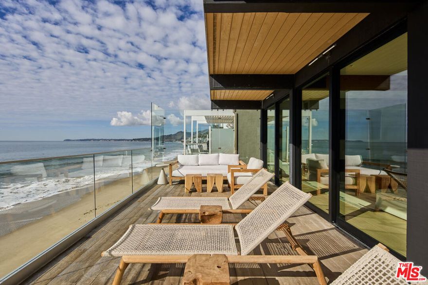 Fully remodeled in 2021, this spectacular oceanfront home is situated on a sandy section of Malibu Road. Truly an entertainer's home! Thru the private courtyard, one enters the expansive great room with fireplace and high end chef's kitchen overlooking the ocean. The primary suite encompasses the entire second level with floor to ceiling sliders, offering views from every angle, including the two person shower and soaking tub. The secondary suite is located on the main level. A 3 car garage and large driveway allows for ample parking. Located near the shops and restaurants of Cross Creek, Soho House, and world class surf spots!