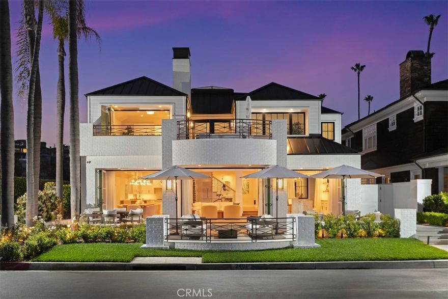 Situated on a rare 50-foot-wide corner lot, this newly renovated and expanded home offers a refined yet relaxed lifestyle complete with private beach and bay views and seamless indoor-outdoor living in the heart of one of Newport Beach's most coveted guard-gated bay front communities. The open concept floor plan includes bi-folding doors along the entire first floor showcasing the private beach and bay views. The chef’s kitchen is outfitted with top-tier appliances, refrigerated wine storage, custom cabinetry, large center island and an additional island for casual dining. An entertainer’s dream bar with a custom double waterfall edge, bay views, and wine and beverage refrigerators with an ice maker is perfect for both entertaining and everyday luxury. Upstairs, a versatile great room/media room offers flexible living space, while the primary suite boasts a spa-caliber bath and oversized custom closet. Additional highlights include Savant full home automation; an oversized spa, fire pit, and bi-folding doors; and an oversized garage with expanded storage. The community also features 24/7 guard-gated security, two private beaches, access to boat dock slips, multiple children’s playgrounds, volleyball, and a private walking gate to Balboa Bay Resort/Club and water sport amenities. This is a rare opportunity to own a truly turn-key coastal home in one of Newport’s most sought-after enclaves.