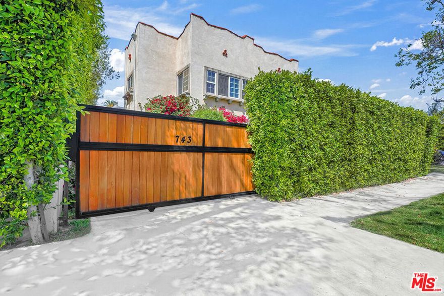 Welcome to your private urban sanctuary. Nestled within a fully gated and hedged compound, this unattached two-story front house offers the perfect blend of privacy and Central LA conveniences from Hancock Park, Larchmont Village, and West Hollywood. Thoughtfully updated for modern living, the residence features wood-style floors, central A/C, and a front garden. The flexible floor plan includes three bedrooms and a unique converted garage studio, perfect for a home office or creative den. The upper level serves as the heart of the home with a bright, open-concept living room, balcony, dining area, and kitchen. The lower level offers versatility, including a bedroom, full bath, and a spacious recreation room with kitchen facilities. Outside, enjoy seamless indoor-outdoor living in your exclusive, shaded front yard, a rarity in this area. With no shared walls and its own entrance, this home feels like a private single-family estate. Available for immediate move-in.