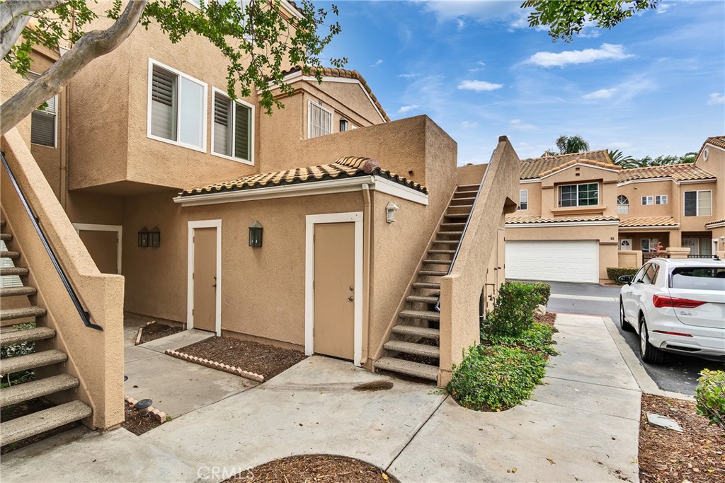 Beautiful end unit, 2 bedrooms and 1.5 bath condo, 1bedroom downstairs and 1 bedroom upstairs in the Portofino Homes of Creekside! This gated community features a pool and park area and a fishing pond for all residents to enjoy. You'll love the oversized patio at the entry, vaulted ceilings with the bedroom sized upstairs loft. It's open and even includes a closet. The loft can be used as an office or play area. The home has lots of windows and vaulted ceilings for plenty of sun and natural light. The large living room includes a cozy fireplace.