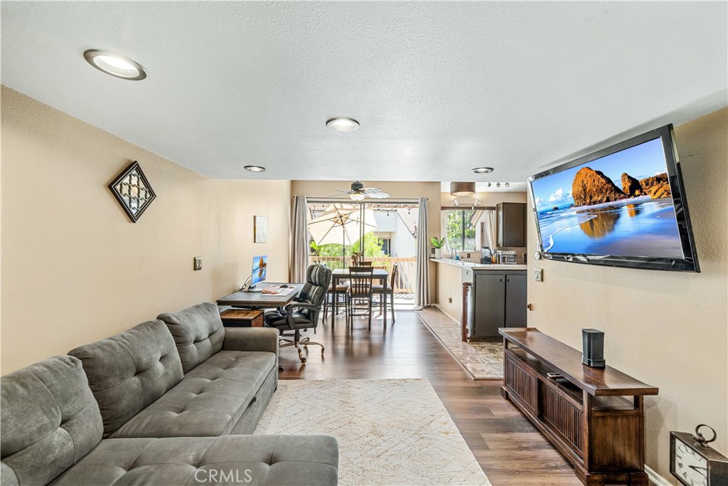 **Charming Loft-Style Condo in a Tranquil Lakeside Community – Perfect for First-Time Homebuyers!**
Welcome to your dream starter home! Nestled in a beautifully landscaped gated community, this fantastic 1-bedroom, 1-bathroom loft-style condo is the perfect blend of comfort and style. With its high ceilings and floor to ceiling windows, this two-story gem is drenched in natural light, creating an inviting atmosphere you'll love coming home to.
Step inside and be greeted by a spacious layout that maximizes every inch of space. The open-concept living area seamlessly connects to a good-sized kitchen, featuring stunning granite countertops, ideal for whipping up your favorite meals or entertaining guests. Convenience is at your fingertips with an indoor washer and dryer closet, making laundry days a breeze. Retreat to your cozy bedroom loft complete with skylight, privacy, ample closet space, ensuring you have room for all your belongings. The full bathroom boasts modern low-flow shower heads, contributing to both sustainability and comfort.
But that's not all! Step outside onto your private balcony where you can sip your morning coffee while overlooking serene fountains, tranquil streams, beautiful Koi fish, turtles and ducks in ponds. This peaceful oasis allows you to unwind after a long day or enjoy a quiet evening under the stars. The community amenities are exceptional, featuring not one, but two full-size gated swimming pools and a rejuvenating spas. Whether you want to take a refreshing dip or relax in the warm bubbling waters, your leisure time is well catered for.
Centrally located, this condo is just a short stroll away from paved bike paths, walking areas and park, perfect for outdoor enthusiasts. You're minutes away from the Historic Garden Grove Main Street, offering a delightful mix of shops, cafes, restaurants and local attractions. Plus, you'll appreciate the convenience of nearby Costco/Gas, Home Depot and other essential shopping destinations.
Additional benefits include a new SPC (stone plastic flooring) with superior durability, new water heater, new water filtration system, multiple storage closets and a dedicated garage space for your convenience.
Don't miss the opportunity to own this exceptional condo in a peaceful and friendly community. This is not just a home; it's a lifestyle. Schedule your private tour today and envision your life in this beautiful condo!