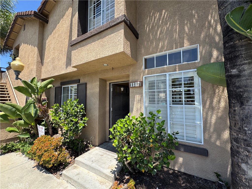 Don't miss taking a look! This spacious home with high ceilings, two bedrooms with full baths upstairs, a den and full bath downstairs, and a large patio is located in a very well managed gated HOA with a pool, jacuzzi, clubhouse and playground. This one has potential!
