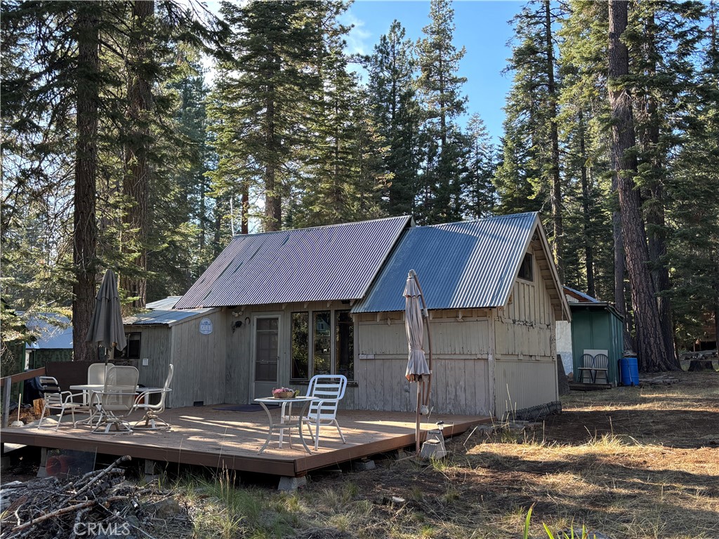 Creek Front. Lush Meadows. Majestic Trees. Blue Sky. Bright Stars. Two Cabins. Private Community with Jointly Owned Open Spaces. Friendly Neighbors.
This rare combination of fantastic features can be yours. Imagine sitting on your expansive deck, listening to the babbling Jones Creek, soaking up the the soft, tree filtered sunlight, watching the forest friends frolic and follow the quiet ways of this natural setting. The primary cabin is a one bedroom, one bath cutie with fully equipped kitchen, and even washer and dryer hook-ups. There is a small loft sleeping space (or storage) in the bedroom. The bedroom has shutters which allow for views and evening breezes to soothe your soul. Cabin two sports a large area for a bed, the vanity, and still has room for storage. Perfect for overnight guests, or given the inspirational feeling to this special property, perhaps as an art studio, a meditation retreat, or the proverbial man cave/she shed. Properties in this private cabin tract seldom sell on the open market, making this an even more special opportunity. Make your mountain dreams come true. Come to Jonesville and see what peace finds you.