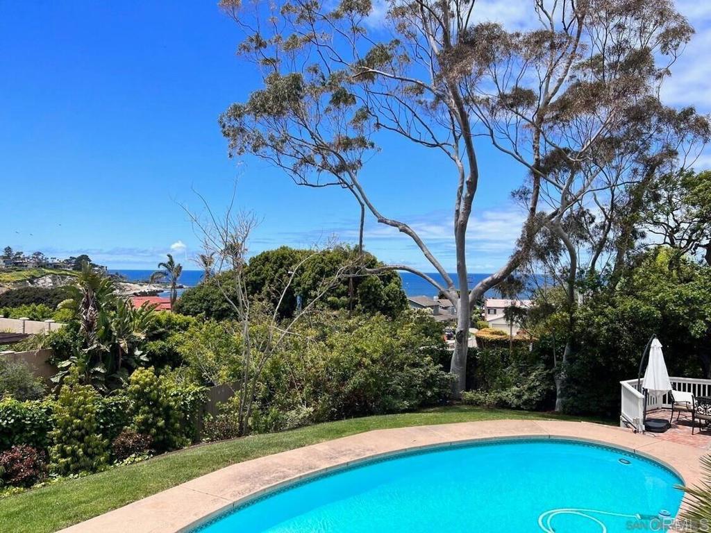 Now available for long-term lease: a stunning 1949 residence designed by renowned architect Tom Shepherd, offering whitewater ocean views and timeless charm in La Jolla’s coveted Hillside neighborhood. With easy access in and out of town, this thoughtfully designed home blends architectural pedigree with modern comfort. The living spaces are bright and inviting, with a spacious deck off the oversized formal living room, plus a separate informal living room that's adjacent to the home's entry. The main house includes 3 bedrooms and 3 bathrooms, including a spacious primary suite with breathtaking ocean views and a recently renovated, spa-inspired marble bathroom with steam shower. A private 1 bed/1 bath casita with a kitchenette sits on the lower pool level, separate from the main residence — perfect for guests, a home office, or extended family. Enjoy outdoor living in the gated front courtyard with a fountain, as well as beautifully landscaped grounds that include a sparkling in-ground pool with removable safety fencing. Additional highlights include central A/C, a private gated entry, an attached two-car garage with laundry, and a basement for extra storage. A rare opportunity to lease a piece of La Jolla architectural history with flexibility, privacy, and breathtaking views. Owner pays for Pool & Landscaping. Tenant pays for all utilities. Pets negotiable with an additional deposit.