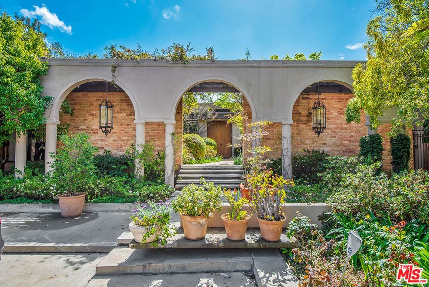 Sensational 2-story estate set back from the street on lower Summit Drive in Beverly Hills offering 5 bedrooms +9 baths. Spacious motor court and courtyard entry opens to a great room with fireplace, soaring ceilings and hardwood floors.  Formal dining room, private office with f/p, and open den featuring full bar and floor-to-ceiling temp controlled wine cellar. Large master suite with fireplace, double baths and closets. Separate children's wing, staff quarters and guest suite with a second kitchen. Sprawling outdoor spaces perfect for entertaining with beautiful pool and spa.  Across the pool find a detached 1+1 guest house with kitchenette and murphy bed. A very special property close to Beverly Hills shopping and restaurants.