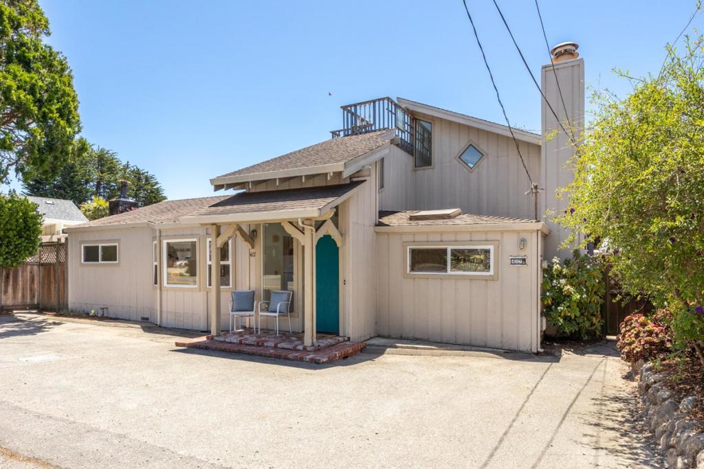 Welcome to your coastal retreat in the heart of Aptos! Situated on a large lot, this inviting beach house offers the perfect blend of comfort and seaside charm. The partial ocean view from the top floor offers the perfect backdrop for that beach style of living. Enjoy separation from downstairs with one bed and one bath upstairs, plus common living space and wet bar to take in the views. Downstairs features another bedroom and two common living spaces, where you can access the private back patio with lush tropical landscape. To top it all off, the location is as good as it gets. Located right around the corner from the Beachgate trail down to Seacliff beach where you can walk for miles. And with some of the best Mexican food just down the street at Manuel's and ice cream at the famous Marianne's, you simply cannot beat this location. Whether you're looking for a weekend getaway or a full-time residence, this property delivers in all the right ways.