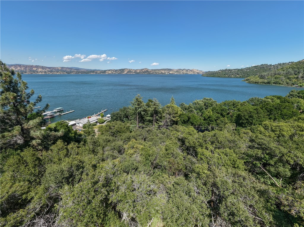 Welcome to your future haven, perched majestically above Clearlake, showcasing stunning panoramic views of the lake and the surrounding mountain vistas. This expansive 0.62-acre lot offers a rare opportunity to build your dream home in a serene setting. Imagine sipping your morning coffee while taking in the breathtaking view. Plans are on file for a single-level 1,900 square foot home, perfectly designed with three bedrooms and two bathrooms, complete with a spacious lower-level three-car garage.
Need power? Not a problem, as utilities are conveniently nearby. There’s also a completed soil test approved for a three-bedroom setup, ensuring a smooth start to your build.
The location couldn't be better. You're just a short stroll from the lake and within walking distance to local dining establishments, offering the perfect blend of tranquility and community. The lot features a graded road and survey markers seamlessly connecting Konocti Bay Road to Soda Bay Road.
This property is a blank canvas, ready for your vision. Whether you're setting down roots or creating a getaway, this lot is an unparalleled opportunity to embrace lakeside living. Contact me today to explore the possibilities and make this stunning piece of land your own!