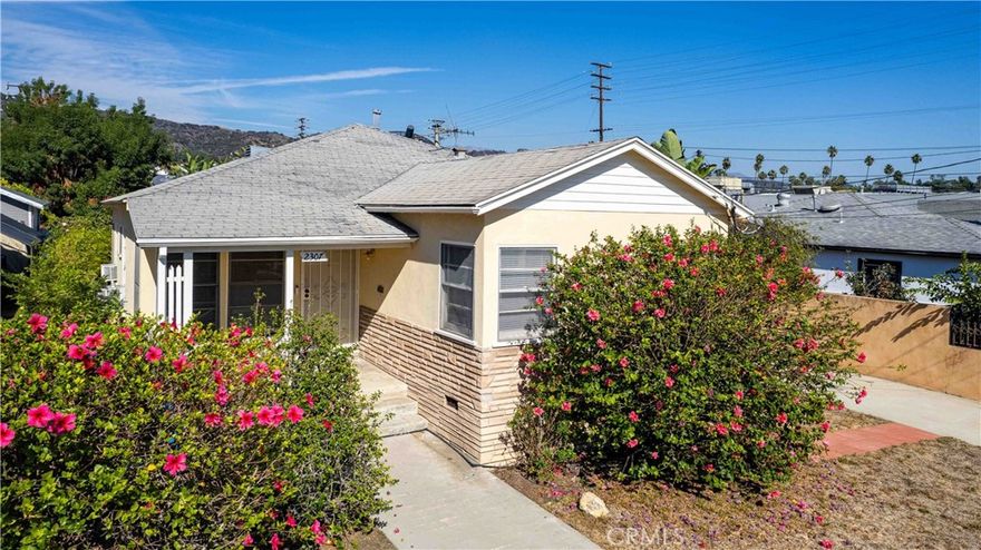 Discover this charming single-family home nestled west of Each Rock Boulevard in the vibrant Eagle Rock community. Perfectly positioned near Sprouts Market, shops, cafes, and parks, this property offers both comfort and great potential. Built in 1940, it boasts vintage character with the opportunity to add modern updates.  Featuring beautiful hardwood floors, 2 bedrooms, and 1 full bathroom, this home spans approximately 1,110 square feet of living space and has an oversized single car garage. Situated on a 4,859 square foot lot, it provides ample yard space and a superb location for enjoying the best of Eagle Rock. Use it as is or bring your vision to life—this property is ready for your personal touch!