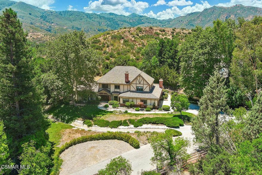 Nestled on an expansive lot in the scenic hills of Agoura, this exceptional estate offers the perfect blend of privacy, space, and sophistication. Ideal for those seeking serenity without sacrificing convenience, the property is minutes from upscale shopping, wineries, dining and top rated schools. Located in the Santa Monica mountains,Close proximity to the Santa Monica Mountains National Recreation Area, Zuma Beach, Point Dume, Paradise Cove, Cornell Wine Co. and much more.  Located on a secluded private road shared with only 3 other neighbors, this one-of-a-kind property provides a rare sense of tranquility and exclusivity. Offering 5 bedrooms, 6 baths, and a  spacious study, this 4,796 sq.ft. home on 1.36 acres has it all. Upon entering, you'll be captivated by the soaring high beamed wood ceilings. Spacious living areas, large picturesque windows and natural sunlight create a warm and sophisticated ambiance. The large gourmet kitchen and resort-style backyard are both perfect for entertaining. Step outside to the sparkling pool and spa with multiple lounge areas and  incredible views of the open land, all of which are part of this magnificent property. The sprawling grounds offer opportunities for equestrian use, gardens, tennis and much, much more. The over- sized and air conditioned 3 car garage provides ample space for vehicles, storage and/or a workshop. Whether you're dreaming of a peaceful retreat, a luxury compound, or a creative haven surrounded by nature, this Agoura gem delivers the ultimate Southern California lifestyle in a true extraordinary setting.