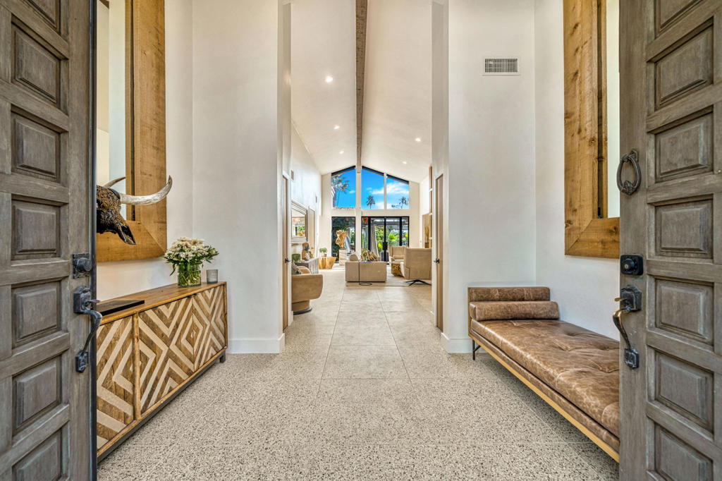 Modern Luxury Meets Resort-Style LivingDesigner Remodeled Estate with Breathtaking Indoor-Outdoor FlowExperience the pinnacle of California luxury living in this newly remodeled designer home, where every detail has been thoughtfully curated to inspire comfort, elegance, and effortless entertaining. Set on a beautifully landscaped 1/3-acre lot, this private retreat offers a seamless fusion of indoor and outdoor living with a resort-like ambiance.Entering the home you are welcomed by huge vaulted ceilings, Italian terrazzo-style tile flooring, new modern doors and custom cabinetry throughout. A fully reimagined open-concept kitchen is perfect for entertaining, featuring a large custom sushi-style island with prep sink, crystal quartzite countertops, and Miele appliances--a true chef's dream. A pass-through kitchen window enhances outdoor entertaining, perfectly connecting the kitchen with the expansive backyard and pool area. The interiors continue to boast all new custom modern oak cabinetry, designer lighting and fixtures, and French doors providing a personalized outdoor experience from each living space. A striking custom fireplace anchors the main living area, balancing warmth and modern design with built-in storage and style. A chic floor-to-ceiling glass penny tile powder room is set aside for the living area and guests.Each bedroom is a private retreat with its own en-suite bathroom, showcasing a new vanity, designer tile and elevated finishes. The primary suite offers a zen-like escape with a spa-inspired wet room, separate toilet closet, tranquil ambiance with ample natural lighting.Celebrating your outdoor living experience you will enjoy your newly renovated pool and spa, expansive shaded gazebo and multiple lounge areas great for large celebrations or intimate gatherings. The lush natural lawn is shaded by a mature olive grove, and enjoys a completely fenced yard for added security and privacy with tall ficus hedges surrounding the entire property.Whether you're hosting guests or enjoying peaceful moments alone, this home is a masterclass in contemporary resort-style living. Chic. Private. Breathtaking. Available for 2 - 12 month lease periods. Make your reservation today!