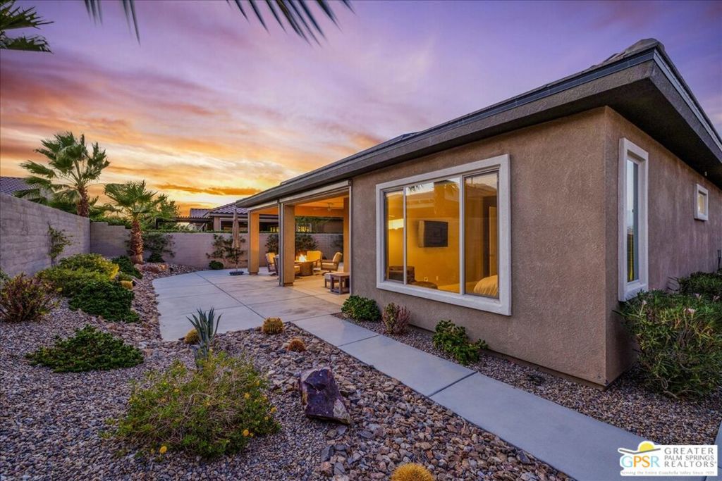 Welcome to the premier 55+ community of Del Webb Rancho Mirage, where resort-style living blends seamlessly with refined design. This desirable Phase 1, Plan 6 PRESERVE floorplan with a Prairie facade offers 2 bedrooms, 2 bathrooms, and a versatile den/flex spaceperfect for a home office, media room, or creative studio. Step inside to discover custom window treatments, high-end Minka ceiling fans, and elegant 12"x24" tile flooring throughout. The open-concept design centers around a chef's kitchen featuring an upgraded Whirlpool appliance package with dual ovens, premium cabinetry with dovetail joints and soft-close drawers, 42" staggered upper cabinets, quartz countertops with full backsplash, a spacious island with pendant lighting with ample seating, and a walk-in pantry. The kitchen flows effortlessly into the generous living and dining areas, highlighted by dual upgraded sliding doors that open to an extended covered patio - complete with electronic zipper shades, expanded hardscape, offering plenty of room for outdoor dining, lounging, or entertaining. Your private retreat awaits in the spacious primary suite, where the ensuite bath offers upgraded vanity sconces, dual sinks with quartz countertops, premium cabinetry, a large walk-in shower with quartz surround, and a generous walk-in closet. The guest bedroom and enclosed den/flex space (with stylish dual barn doors) are thoughtfully positioned on the opposite side of the home for added privacy, alongside a full secondary bath. Additional highlights include leased SOLAR ($58.16Mo), an expanded laundry room with utility sink and extra cabinetry, plus an oversized, fully painted garage with space for an extra-large vehicle and/or additional storage. Within the gates of Del Webb Rancho Mirage, you'll enjoy an active, vibrant lifestyle with access to a state-of-the-art clubhouse, resort-style pool and spa, fitness center, and a wide range of activities including bocce ball, tennis, pickleball, and more. Come experience luxury, comfort, and community in one of the desert's most sought-after addresses.