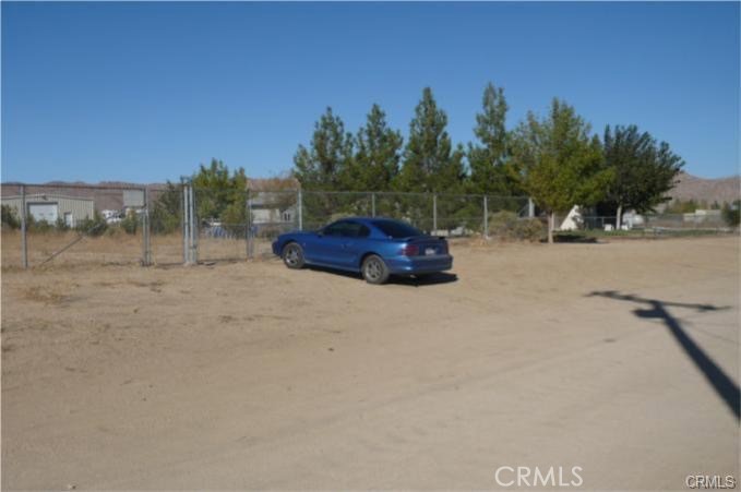 This level 4.70 acres on Highway 18 presents a compelling investment opportunity. The property is situated adjacent to Via Seco Rd, with houses surrounding it. Potential buyers have the option to construct their homes on one of the two lots, subdividing one facing Highway 18 and the other at the end of Via Seco Rd.
A significant portion of the lot is fenced on Via Seco Rd, extending all the way to Highway 18. The seller is motivated, making it an excellent investment opportunity.
The property’s location is ideal, being close to Highway 18, an electricity pole, and a maintained road. It offers ample space for constructing a new home or establishing a ranch. The surrounding area includes houses, providing access to utilities and amenities.
The fenced portion of the lot extends to Via Seco Rd, while the remaining area stretches to Highway 18. This property presents a unique opportunity for individuals seeking to build their own homes or establish ranches, utilizing the spacious lot for recreational activities and storage.