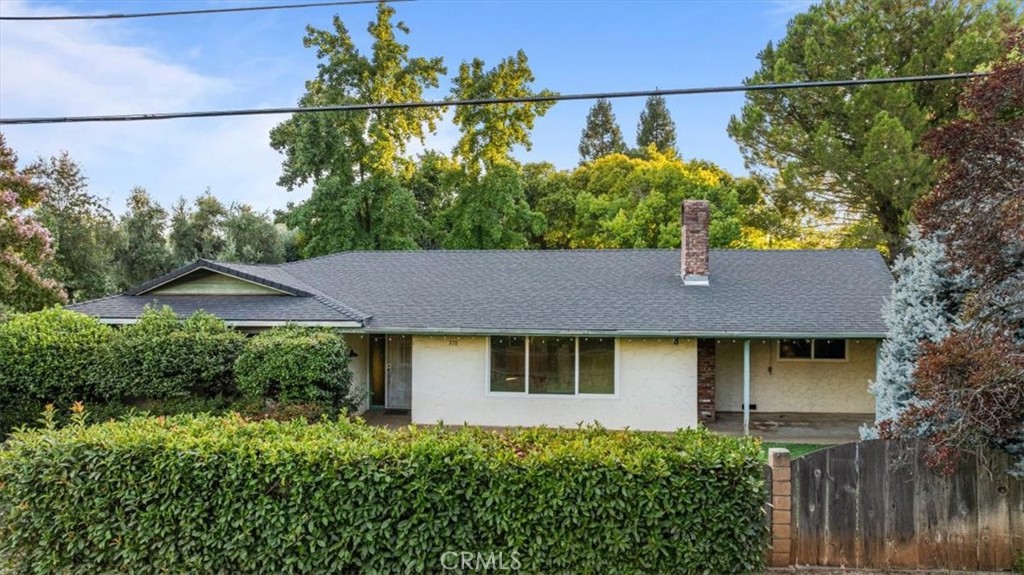 This charming 3-bedroom, 2-bathroom home blends comfort, efficiency, and a stunning outdoor setting. Set on a lot with a true parklike feel, you’ll love the mature trees, lush green lawn areas, and raised garden beds that create both beauty and functionality. Inside, the open and airy floor plan immediately feels inviting. The spacious living room is filled with natural light and anchored by a charming white brick wood stove, perfect for cozy evenings. The kitchen is well-appointed with stainless steel appliances, a gas range, tile counters, and plenty of cabinet space, while the breakfast bar adds a casual spot to gather. Just off the dining area, you’ll find a versatile bonus room that can easily serve as a sunroom, home gym, hobby room, or additional living space—the choice is yours. The primary suite offers a private retreat with a generous closet and a beautifully updated bathroom featuring a walk-in tiled shower and oversized vanity. Two additional bedrooms, a full guest bath, and an indoor laundry room provide comfort and convenience for everyday living. Practical upgrades make this home stand out: a VA assumable loan opportunity, a 2019 roof with 20 solar panels, and a Sonnen battery backup system deliver energy savings and peace of mind. The attached two-car garage and ceiling fans throughout add to the home’s functionality. Out back, the covered patio sets the stage for entertaining and summer barbecues, while the spacious yard offers room to relax, play, and garden to your heart’s content.